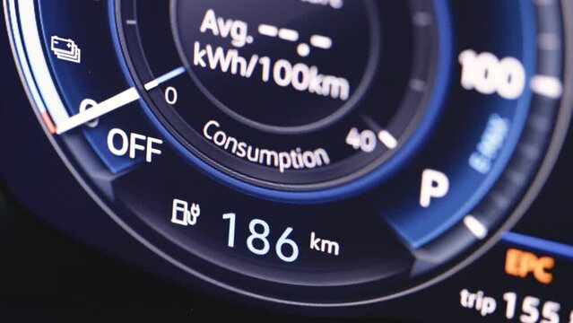 Electric Car Charging Indicating the Progress of the Charging. The indicator shows it fills up to 186 km. Electric vehicle battery indicator showing battery charge. Long range electric vehicle