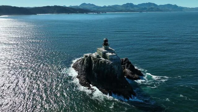 The Pacific Ocean surrounds the lonely, deactivated Tillamook Rock Lighthouse off the scenic Oregon coast. The isolated, historic lighthouse was originally built in 1880.