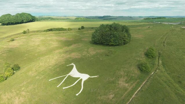 Aerial drone shot of hillside white horse mural in Hackpen Hill, Wiltshire