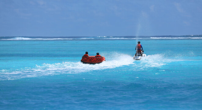water attraction, riding on an inflatable sofa