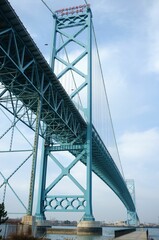 Vertical shot of the Ambassador suspension bridge under the blue sky