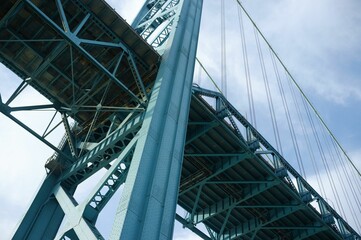 Low angle shot of the Ambassador suspension bridge under the blue sky - Powered by Adobe