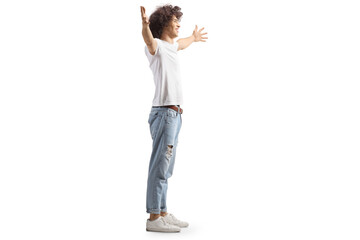 Full length profile shot of a guy with curly hairstyle waiting to hug someone
