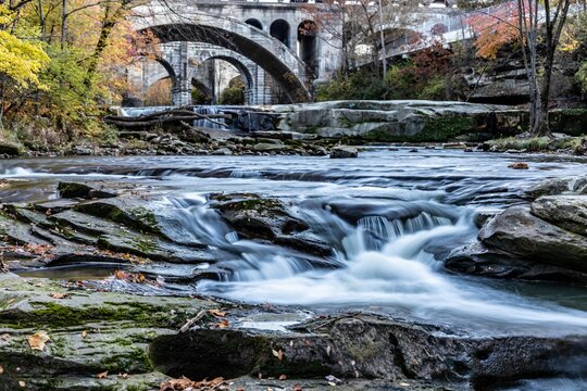 Beautiful shot of Berea waterfalls under the arch bridge in Ohio with a silky water effect