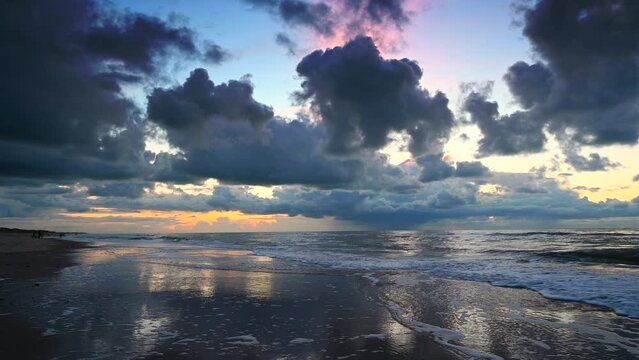 Sunset at the North Sea beach after a stormy autumn day at Texel island in the Dutch Waddensea region in The Netherlands.