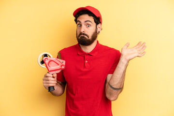 young man feeling puzzled and confused and doubting. company employee concept