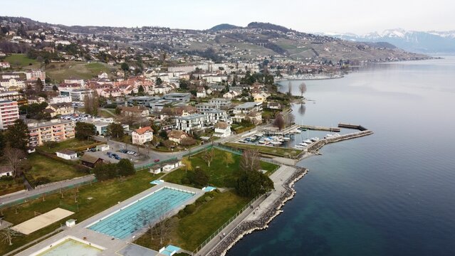 Aerial shot of the Pully swimming pool against a blue sea in Lausanne, Switzerland