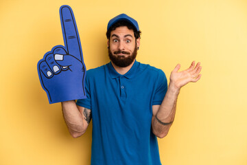 young man feeling puzzled and confused and doubting. one hand fan concept
