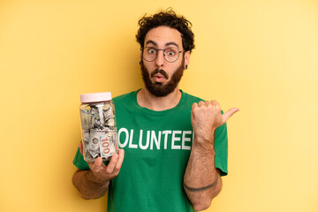 young man looking astonished in disbelief. volunteer concept