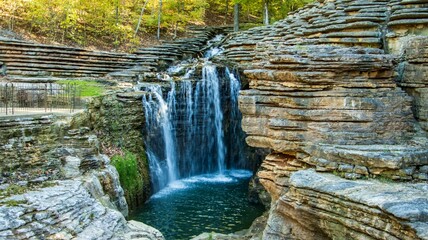 Panoramic view of waterfall over rocks in summer. Princess Louise Falls in Ottawa, Ontario, Canada. © Bowlin Photography & Design/Wirestock Creators