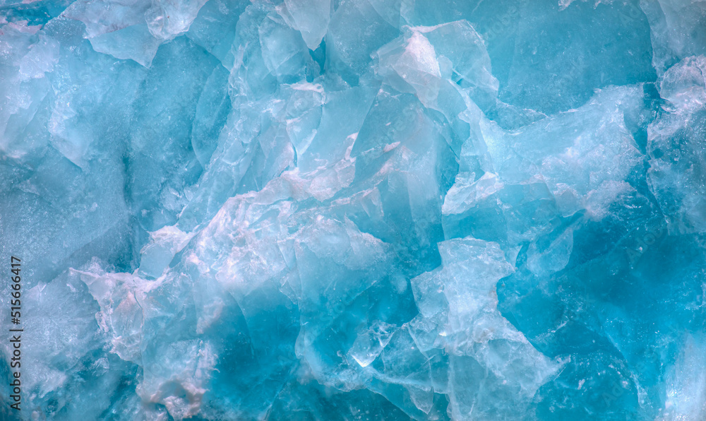 Wall mural a close-up of the layered surface of a blue glacier - knud rasmussen glacier near kulusuk - greenlan