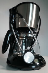 close-up of a stethoscope placed on a coffee machine   