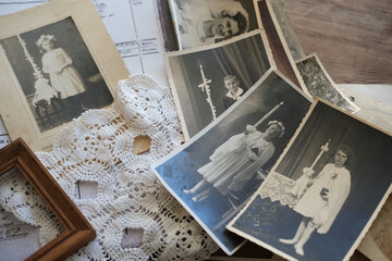 old family photos, pictures from 1940 in sepia color on wooden table, home archive documents,...