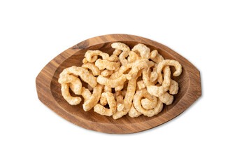 Fried pork skin cracklings on a plate isolated over white background