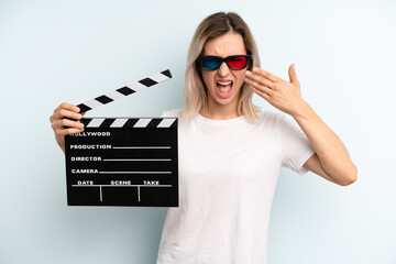 blonde woman looking unhappy and stressed, suicide gesture making gun sign. film or movie concept