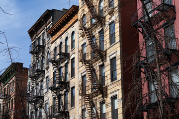 Row of Old Brick Apartment Buildings with Fire Escapes in the East Village of New York City