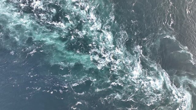 Overhead view of strong current flowing through open water