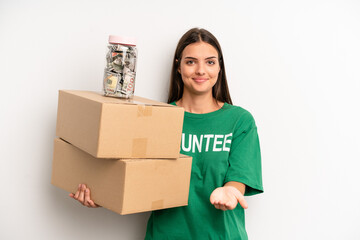 pretty woman smiling happily with friendly and  offering and showing a concept. volunteer and...