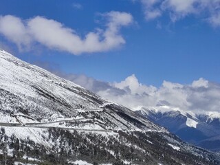 Aerial view of a part of zigzag snowy mountain road on the 318 Sichuan-Tibet highway