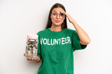 pretty woman looking happy, astonished and surprised. volunteer and donation concept