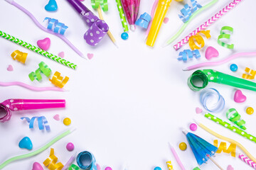 white background with candies,candles , balloons and pipes for a celebrated birthday or party