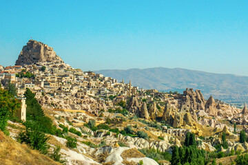 Fototapeta na wymiar Ancient town and a castle of Uchisar dug from a mountains , Cappadocia, Turkey