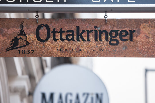 VIENNA, AUSTRIA - NOVEMBER 6, 2019: Logo of Ottakringer beer in front of a local bar cafe in Vienna. Ottakringer bier is an iconic Austrial light beer, Helles type, from Ottakring district in Vienna