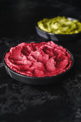 Beetroot hummus and spinach hummus. Vegan recipes, plant-based dishes. Homemade healthy organic food. Vegetarian cuisine. Top view 