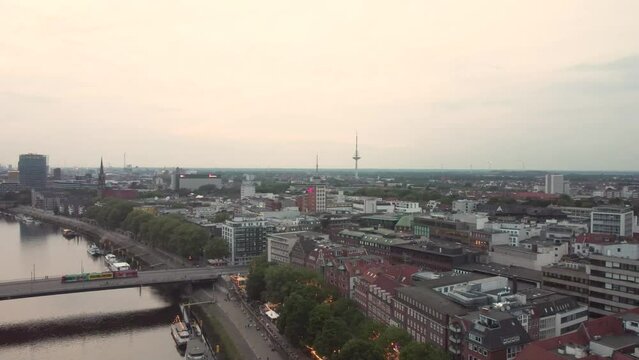 Aerial drone footage of the cityscape of the calm city of Bremen on a cloudy day, Germany