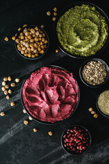 Beetroot hummus and spinach hummus. Vegan recipes, plant-based dishes. Homemade healthy organic food. Vegetarian cuisine. Top view 