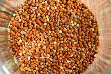 Dry millet grains (Panicum) on the kitchen table. Ingredient for making dietary dishes. Culinary background texture. Top view.