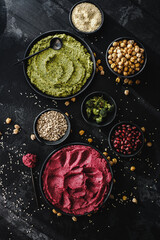 Beetroot hummus and spinach hummus. Vegan recipes, plant-based dishes. Homemade healthy organic food. Vegetarian cuisine. Top view 