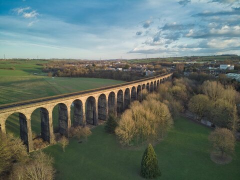 Aerial view of the Cefn-coed Viaduct in Ty Mawr Country Park in Wales in cloudy sky background