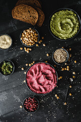 Beetroot hummus and spinach hummus. Vegan recipes, plant-based dishes. Homemade healthy organic food. Vegetarian cuisine. Top view 