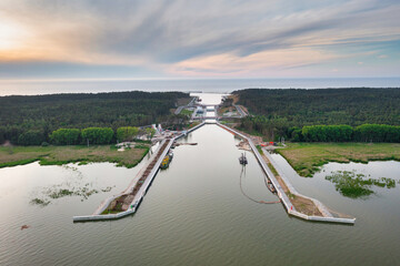 Construction of a canal to the Baltic Sea on the Vistula Spit at sunset. Poland