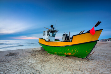 Fototapeta na wymiar Fishing boat on the Baltic Sea beach in Jantar. Poland