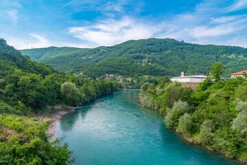 Fototapeta na wymiar View on Drina river between trees. Beautiful view on mountains river in Bosnia and Herzegovina.