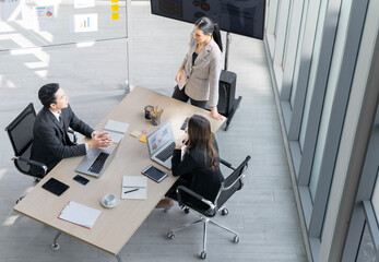 A group of young Asian businessmen Talking and planning work happily and have fun. at the company's...