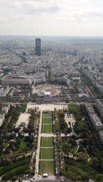 Vertical footage of a cityscape of Paris from top of the Eiffel Tower, France