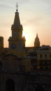 Vertical footage of Cartagena Clock Tower at sunset. Puerta del Reloj, Colombia.