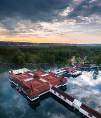 Heviz, Hungary - Aerial view of Lake Heviz at sunrise, the world’s second-largest thermal lake...