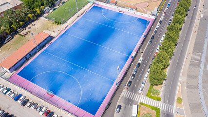 Aerial view on a blue soccer field. © Stefano Tammaro
