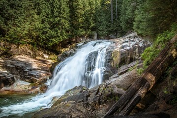 Beautiful view of waterfall on rocks in Hiking Gold Creek Falls, Golden Ears Provincial Park, Canada