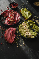 Beetroot hummus and spinach hummus. Vegan recipes, plant-based dishes. Homemade healthy organic food. Vegetarian cuisine. Top view 