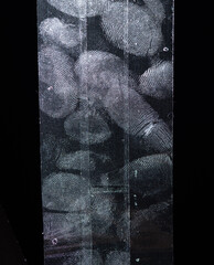 Fingerptint on transparent adhesive tape or strips isolated on black background