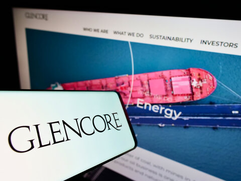 Stuttgart, Germany - 01-28-2022: Smartphone with logo of commodity trading company Glencore plc on screen in front of business website. Focus on center-left of phone display.