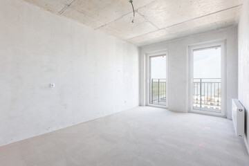 interior of the apartment without decoration in gray colors. rough finish