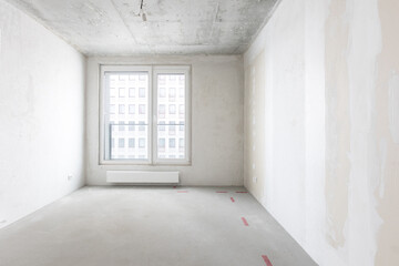 interior of the apartment without decoration in gray colors. rough finish