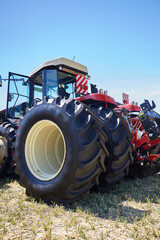 Several modern tractors stand side by side