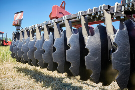 Closeup of a modern black disc harrow